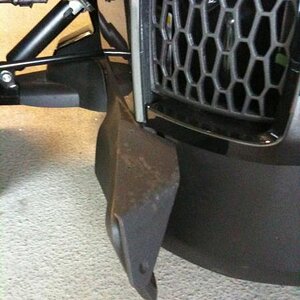 The Sopher custom foot rest; left side. A hidden brace is connected under to the inside frame securing the movement of the bracket and stiffens the en