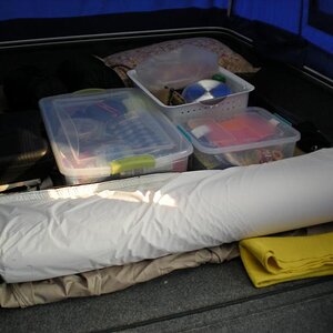 Storage of creature comforts + two lawn chairs which are not loaded in the trailer yet.  Inflatable mattress + egg crate cover for added R-value.