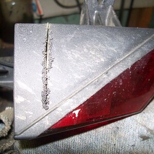 Cut along the jagged line. A hacksaw isn't the gentlest tool, but it does the job.