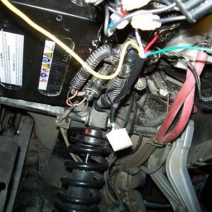 The 6 way connector mounted with cable ties under the guard.