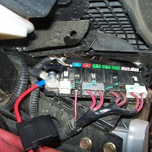 An in-line fuse for the trailer is connected to the live power. I would have used a switched power, but I wanted to have power for a light in the trai