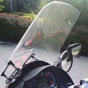 RoboBrackets From Madstad Engineering.  Used with my Cal-Sci 23 & 1/2" windscreen.  I love it during warmer weather.  During the Winter I use BRP's 25