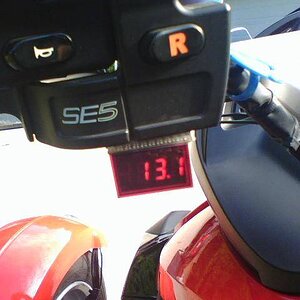 Digital VoltMeter.  Monitors my voltage at all times.  Especially handy in the Winter when using my heated clothing.  I mounted an Off/On switch from 