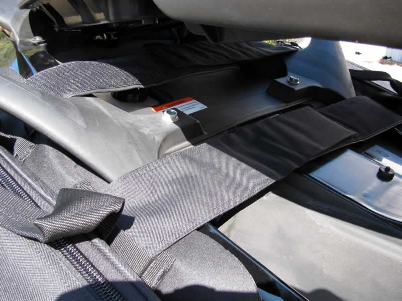 14: Mounting straps fit under the seat