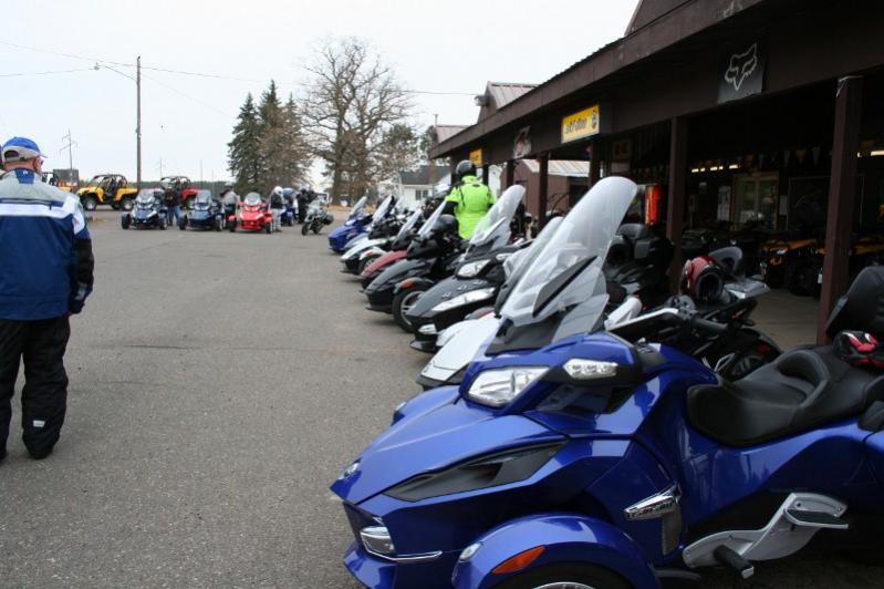 14 Spyders and 4 motorcycles all lined up at Caswell Cycle, Mora, MN - quite a nice gathering for the weather!