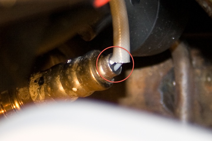 2010 RS O2SensorTooExposed 1 - Annotated oval shows the area where wires are not covered and exposed to elements. I was thinking of covering this up w