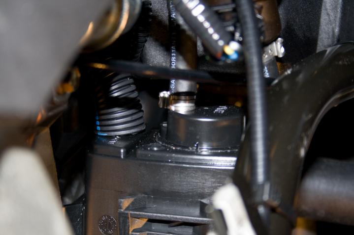 2010 RS SpyderNewEvapCan 2 - Vent hose on the left side of the evap.  canister, closest to the engine. Notice the loom installed over the hose. I did 