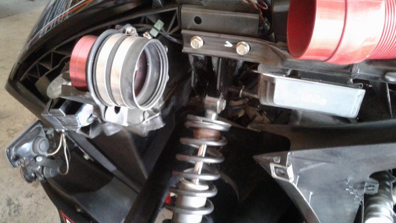 3.  Remove the upper shock bolt...note removing the rectifier will make it possible to remove the bolts and re-install in the new position.