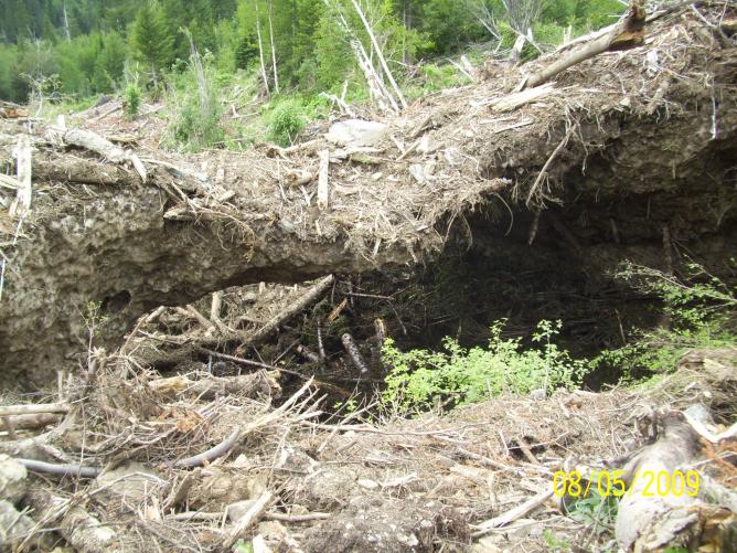 An ice flow where the ground eroded with the water flow.