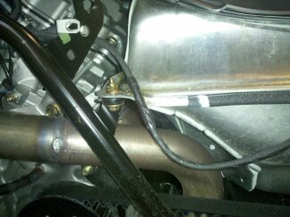 Black duct tape wrapped around wiring harness to provide better protection.