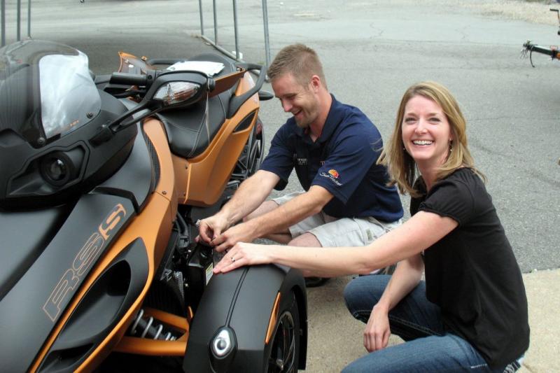 Bradford learning to check oil with Ryan Stephens, service manager at Bradford Marine