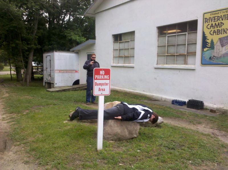 Brian Taking a pic of Deb "Planking" in the Dumpster area - LOL