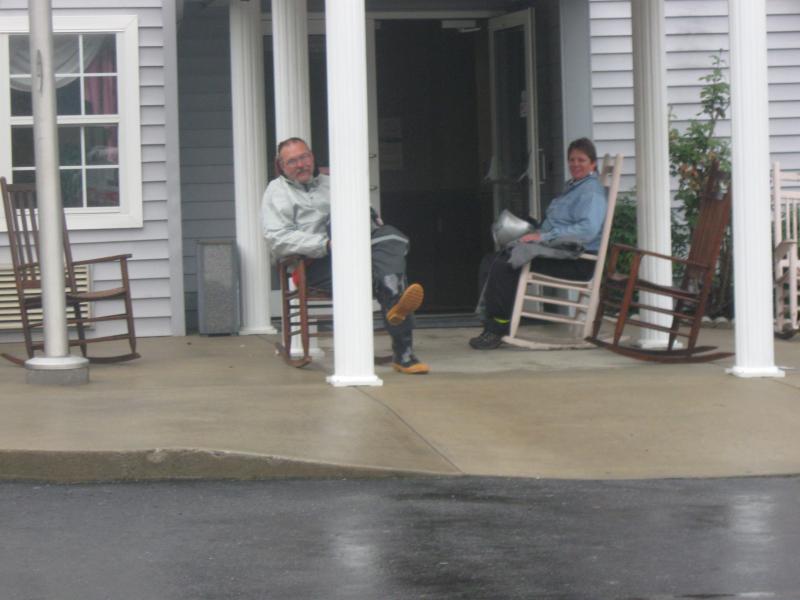 Butch & Kelly enjoying the rocking chairs at the Microtel while waiting for a break in the weather.