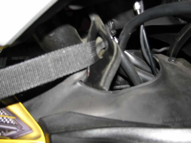 Connect front straps through stock bracket under steering tree