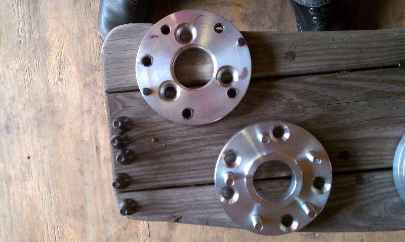 Custom two piece adapters I had made to go from 3 lug to 5 lug