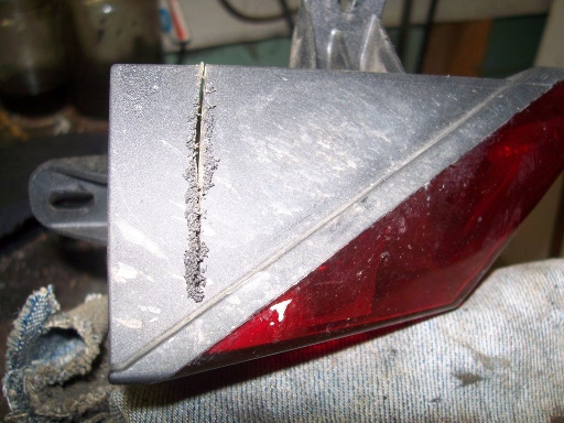 Cut along the jagged line. A hacksaw isn't the gentlest tool, but it does the job.