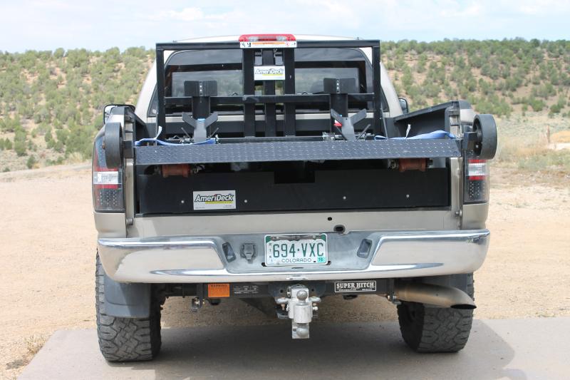 Deck lifted to position in truck.  The deck is above the truck wheelwells allowing tool and equipment storage below deck.  The deck pictured is the st