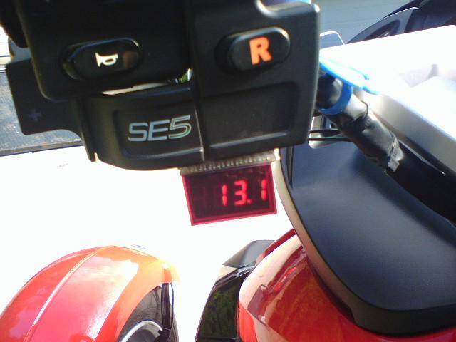 Digital VoltMeter.  Monitors my voltage at all times.  Especially handy in the Winter when using my heated clothing.  I mounted an Off/On switch from 