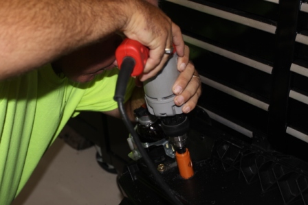 Drilling the 1 1/8" hole for the accessory kit.