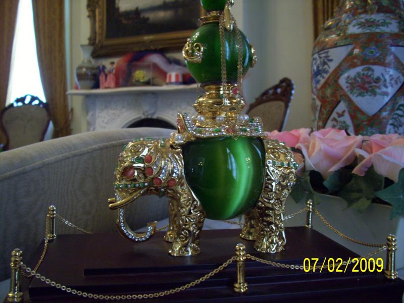 Elephant from India. 3 green cats eyes and jewels.
