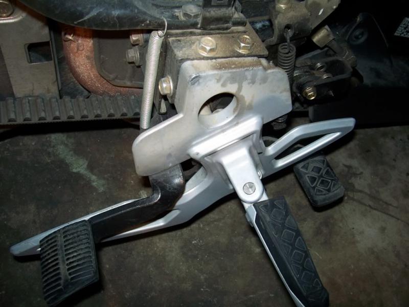 Foot brake. Left side showing return spring