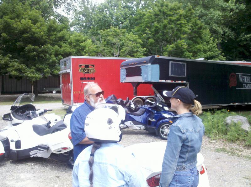 Fred Rau & his wife talking with Denise at the Wheels Thru Time museum