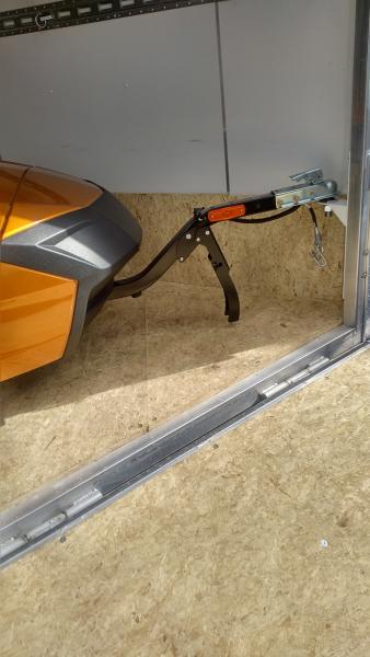 Freedom trailer hitched inside of enclosed trailer