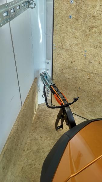 Freedom trailer hitched inside of enclosed trailer