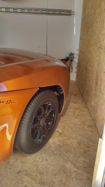 Freedom trailer hitched inside of enclosed trailer