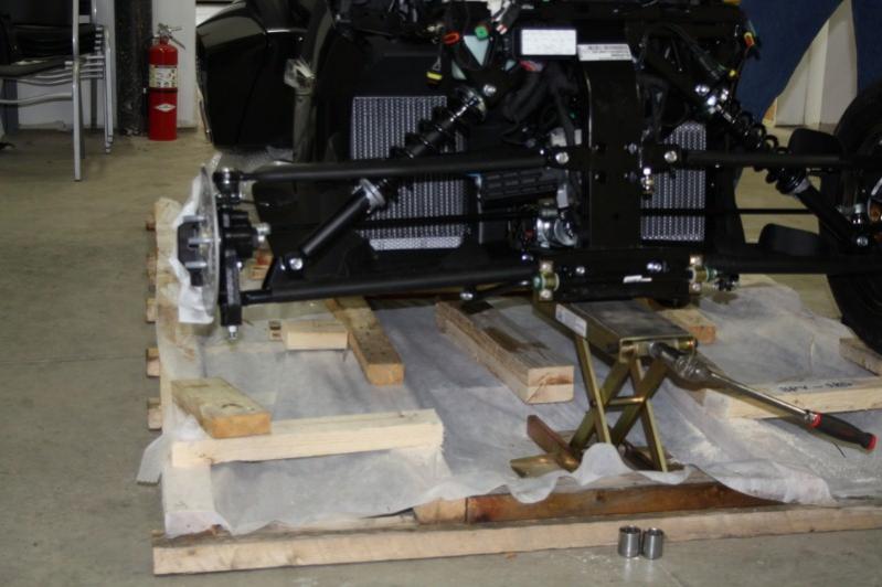 Front end being jacked up to put on wheels. ( a little out of order)