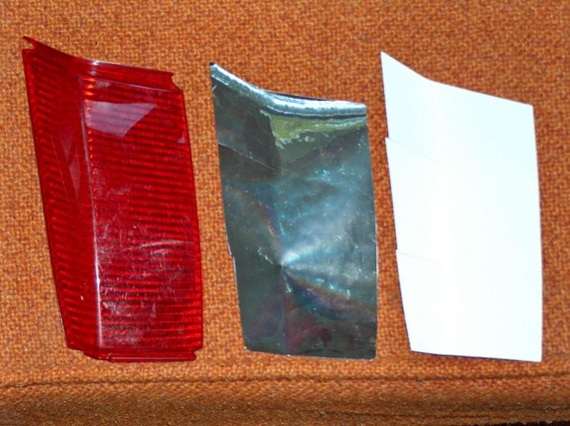 GIVI Bag Lens Backing.  Bare lens on left, new chrome reflective tape  in center, original white backing plastic on right.