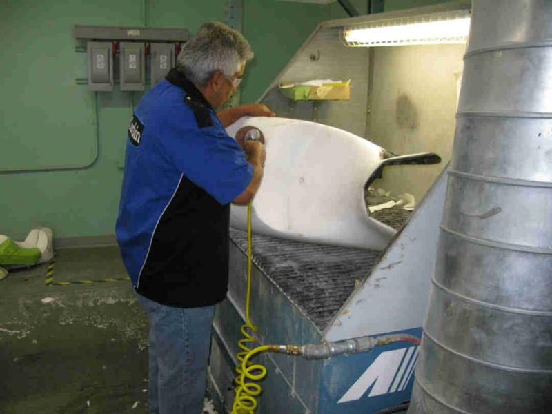 Here Julio is shaping the foam to fit my fat butt.