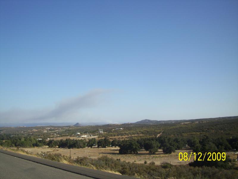 Hills around home; fire in Mexico across the border.