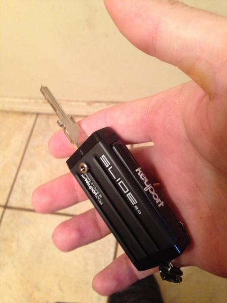 https://mykeyport.com
Holds ignition key, saddle bag key, 2house keys ,& flashlight, thumb drive too
Perfect for me. 
Fyi only 2013& earlier transpond