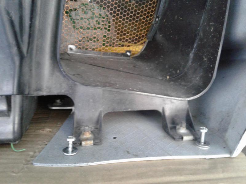 I use large screws two in each air duct opening , to secure it to the plywood platform bolted to the truck box frame .... it touches nothing, and does