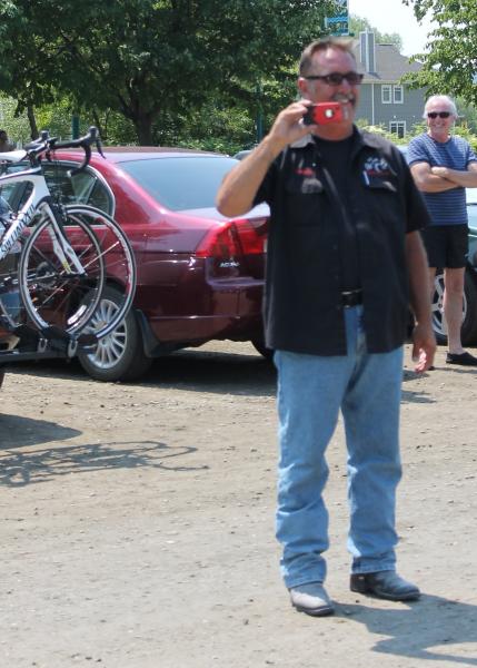 Lamont taking pictures at the start of the parade