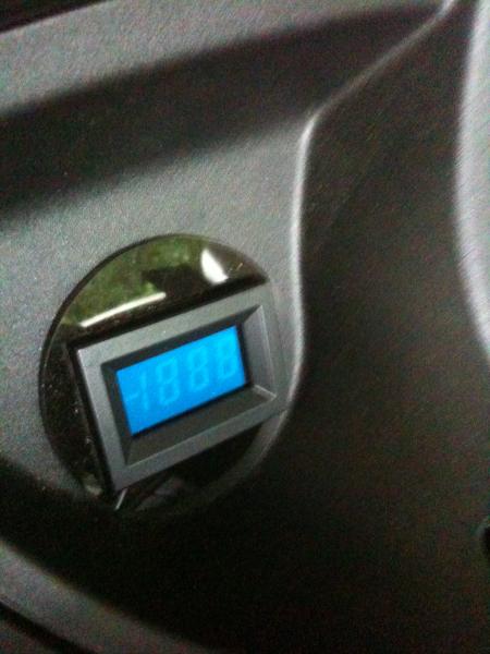 LED voltage meter measuring battery volts and charge current.