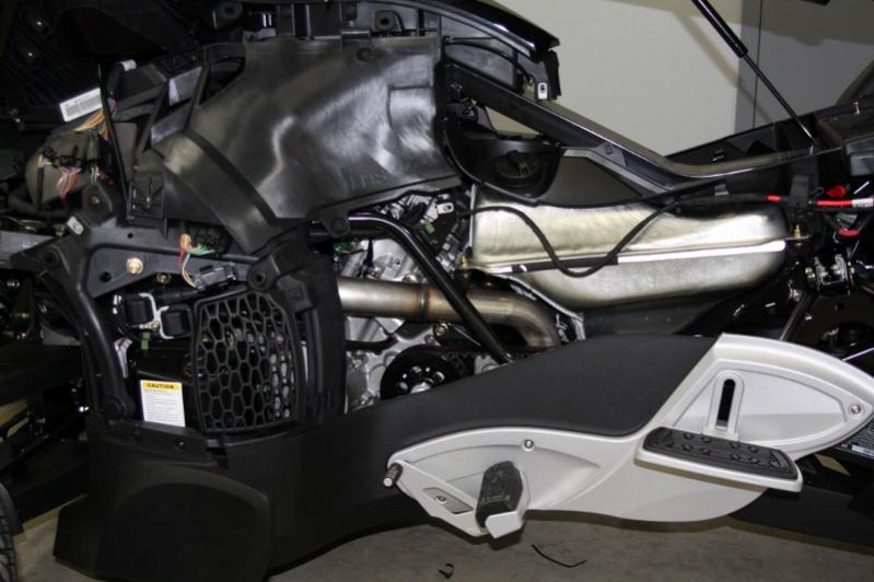 Left side panels removed showing fuel tank exhaust header. The panel giving access to the oil tank, for adding or checking, now is easier to do, do to