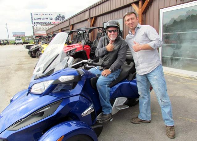 Len showing me the particulars & wishing me safe riding