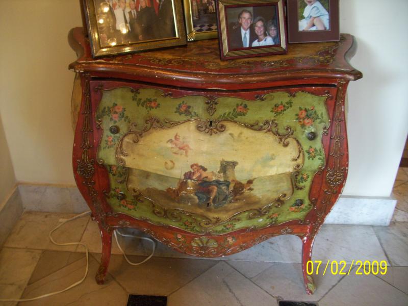 Looked like decoupage to me, but older than dirt.