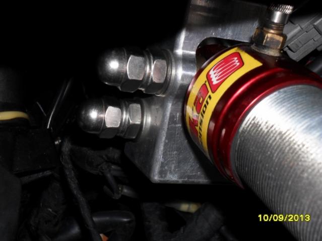 Looking towards the front of the Spyder S/S Dome nuts fitted to keep dirt ect off the bolt threads fitted after the S/S Nyloc nut and washer