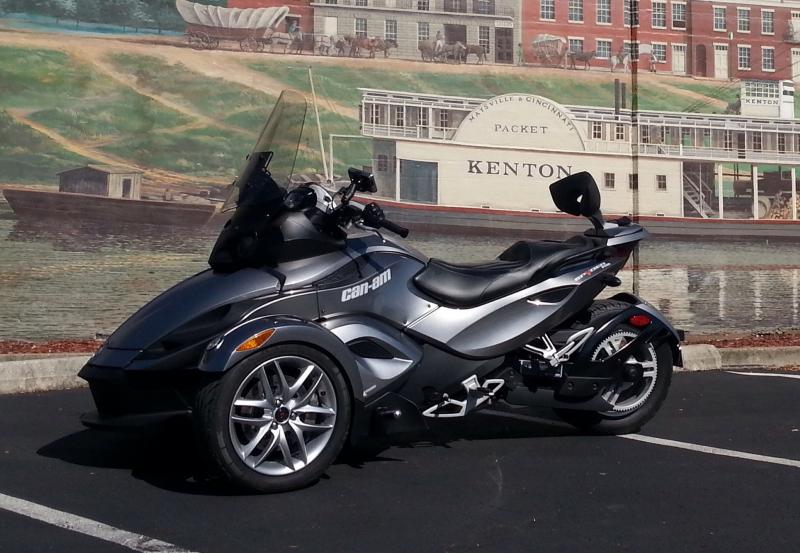 Maysville, KY in front of the painted wall.