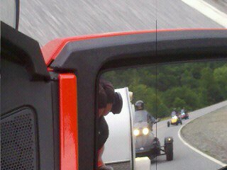 Mirror shot of the Carravan following Lamont to Maggie Valley