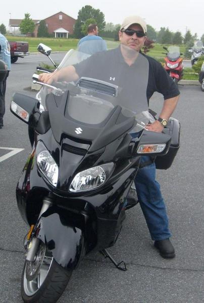 My Suzuki Burgman 650 Executive, May 2009.  Why can't Can Am or an after-market make a windscreen like that for the Spyder?