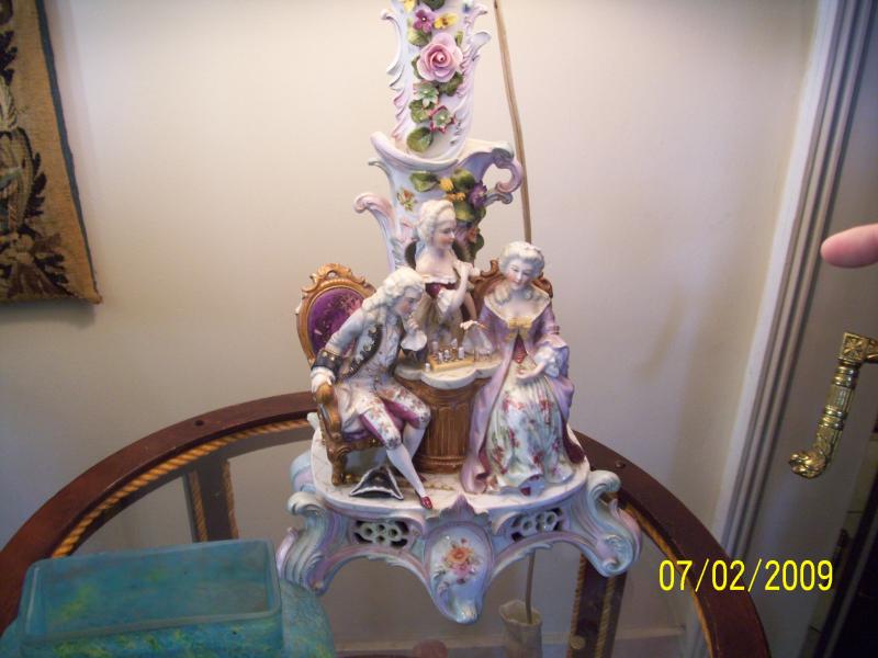 Not bisque or Dresden, some other fancy/costly china. Old too.