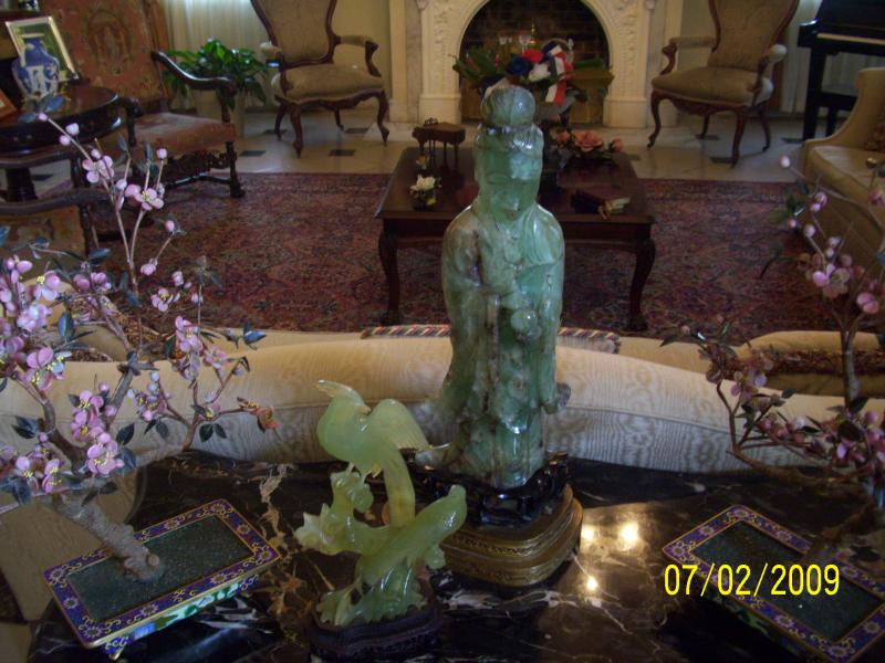 Oldest piece in the house. Skinny Buddha. Translucent. The pink trees are made with Jade petals as is the Buddha and the other figurine.