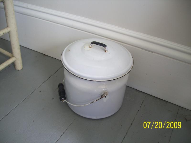 One child visiting is said to have called this a cookie jar; it's another chamber pot. Can you imagine having to empty this each morning? Maybe we wer