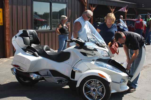 One of the new riders gets checked out on her bike by Len Damouth