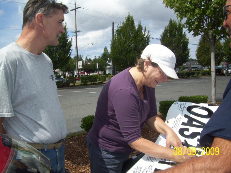 Pat putting her name down.