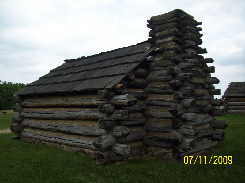 Peplica of cabin, view from the rear.  VF, PA